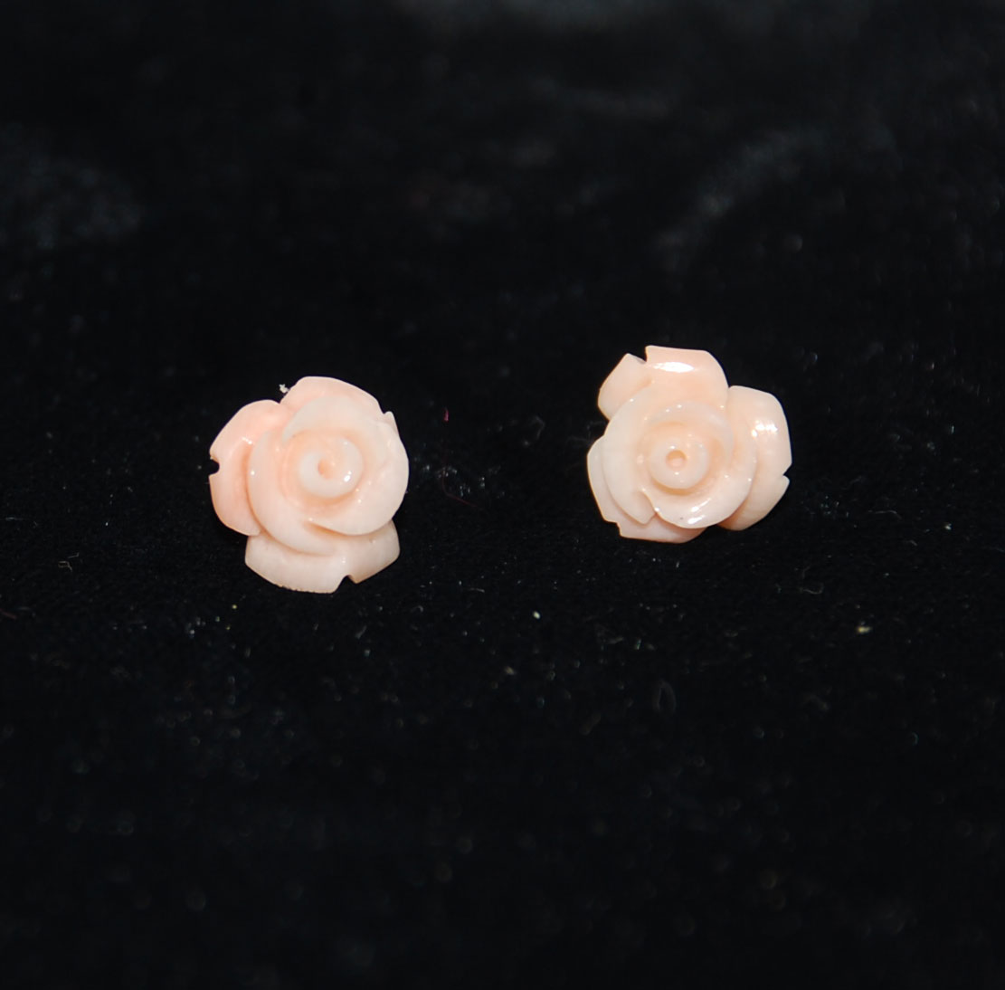 Carved angel skin coral earrings